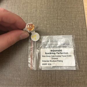 Bomb Party size 7 ring
Dark Smokey Topaz Cubic Zirconia
Rhodium Plating